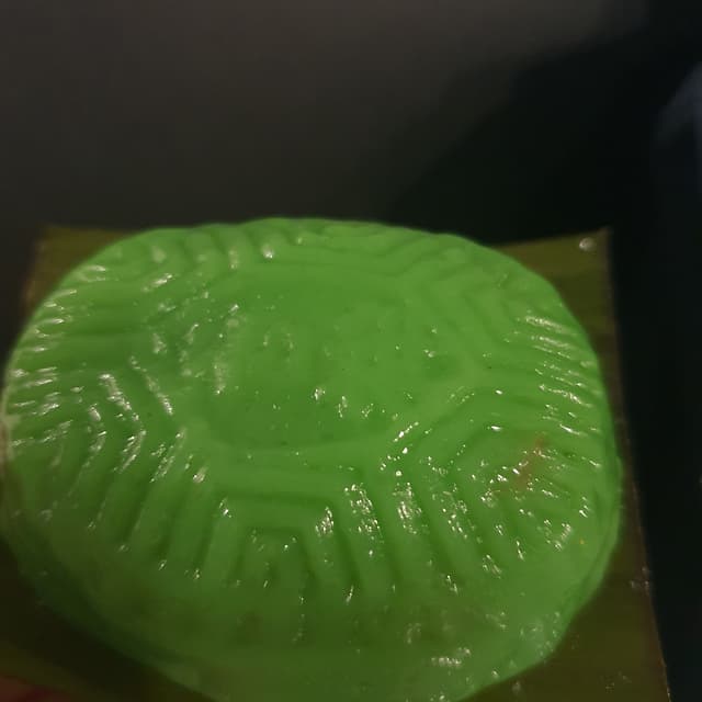 菜肴“Coconut Ang Ku Kueh”的照片