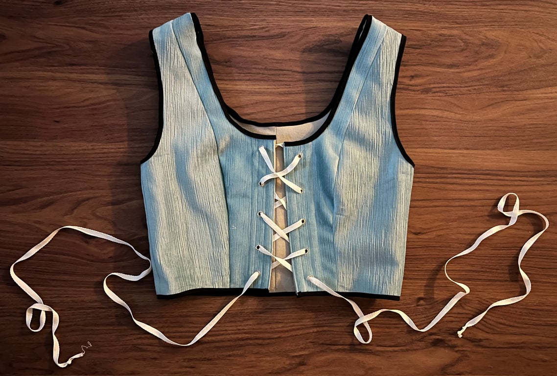 This Tristan top features front lacing