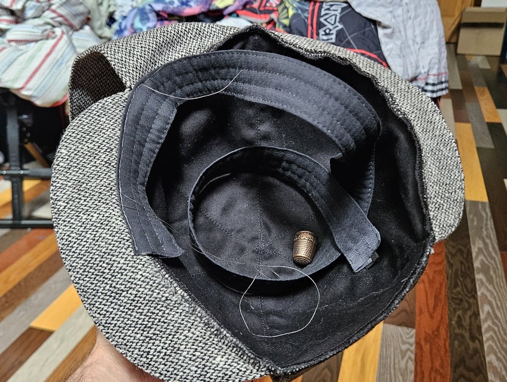 hat with sweatband partially stitched in place