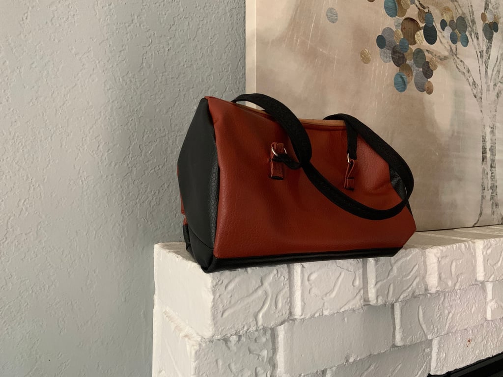 A brown and black Hortensia handbag