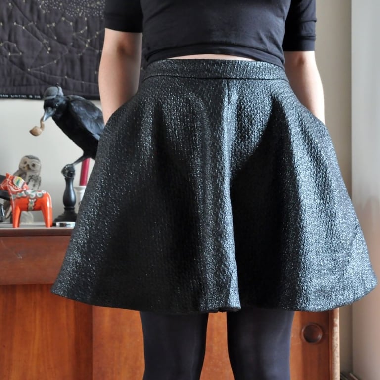 back view of Anneke's shiny black Sandy skirt