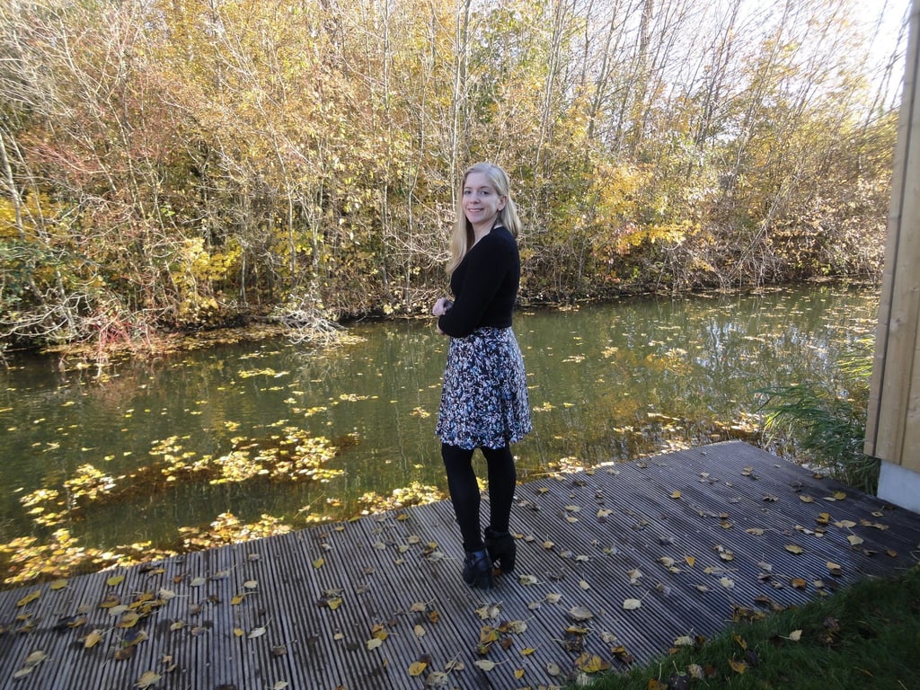 Karin poses by the water in her new skirt