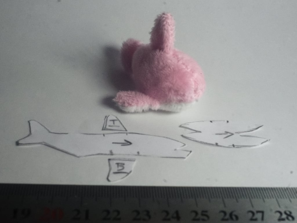 An even smaller pink shark plush, about 6cm in size