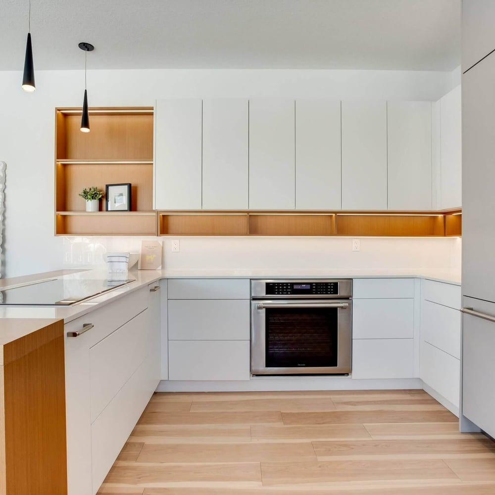 jlVsD2Ko Modern kitchen design featuring white cabinetry, wooden accents, and stainless steel appliances with a minimalist aesthetic.
