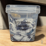 DIY Reusable Disinfecting Wipes in a plastic container.