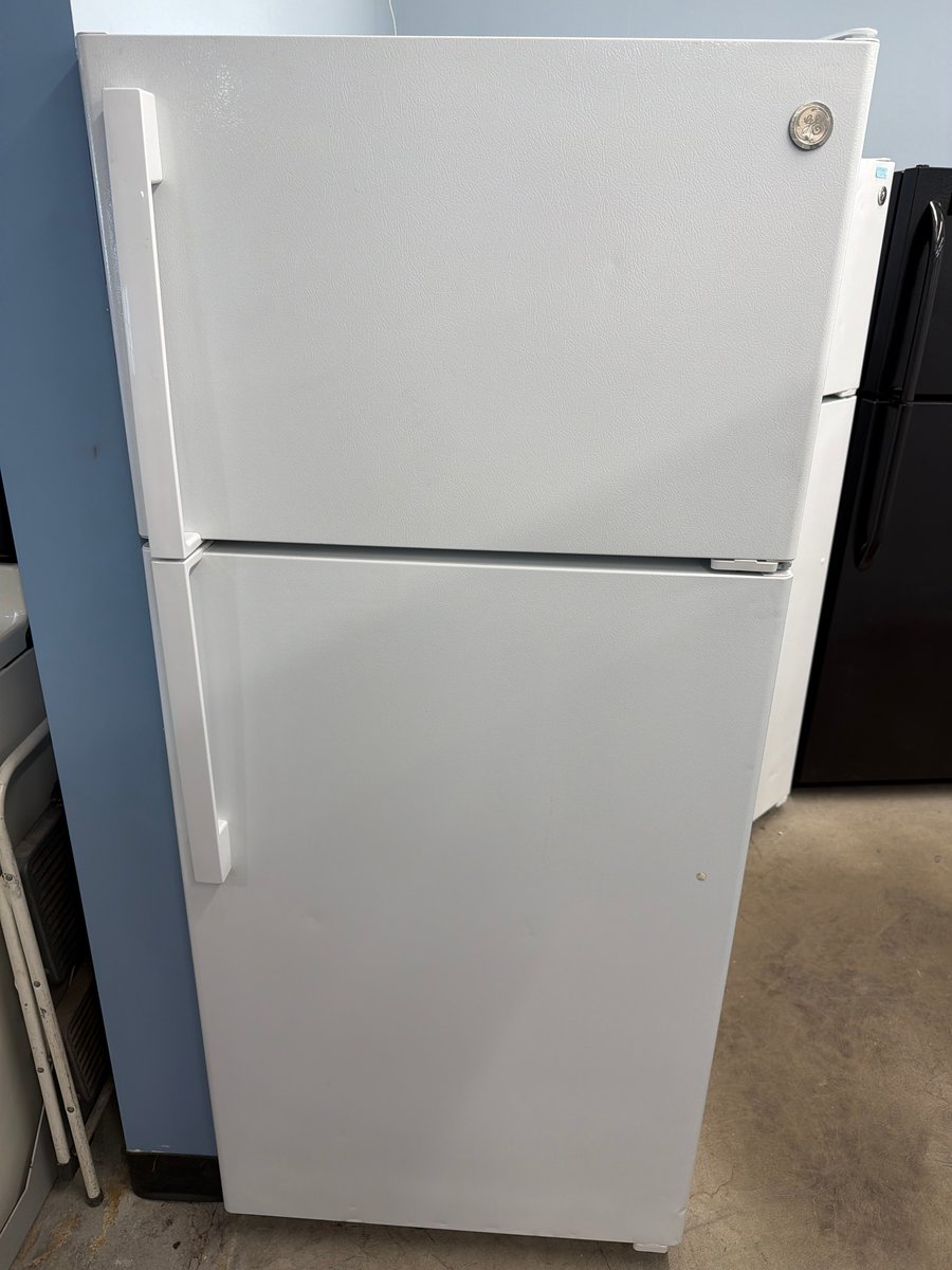 Photo 1 of this exact GE White top mount refrigerator