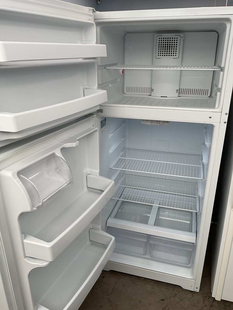 Photo 2 of this exact GE Top mount white refrigerator