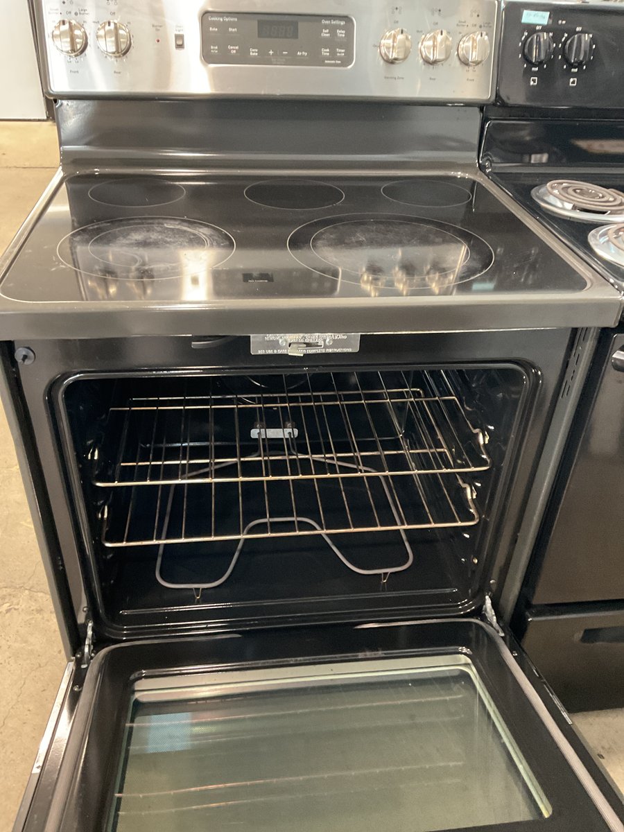 Photo 2 of this exact GE Glass top stainless steel convection range