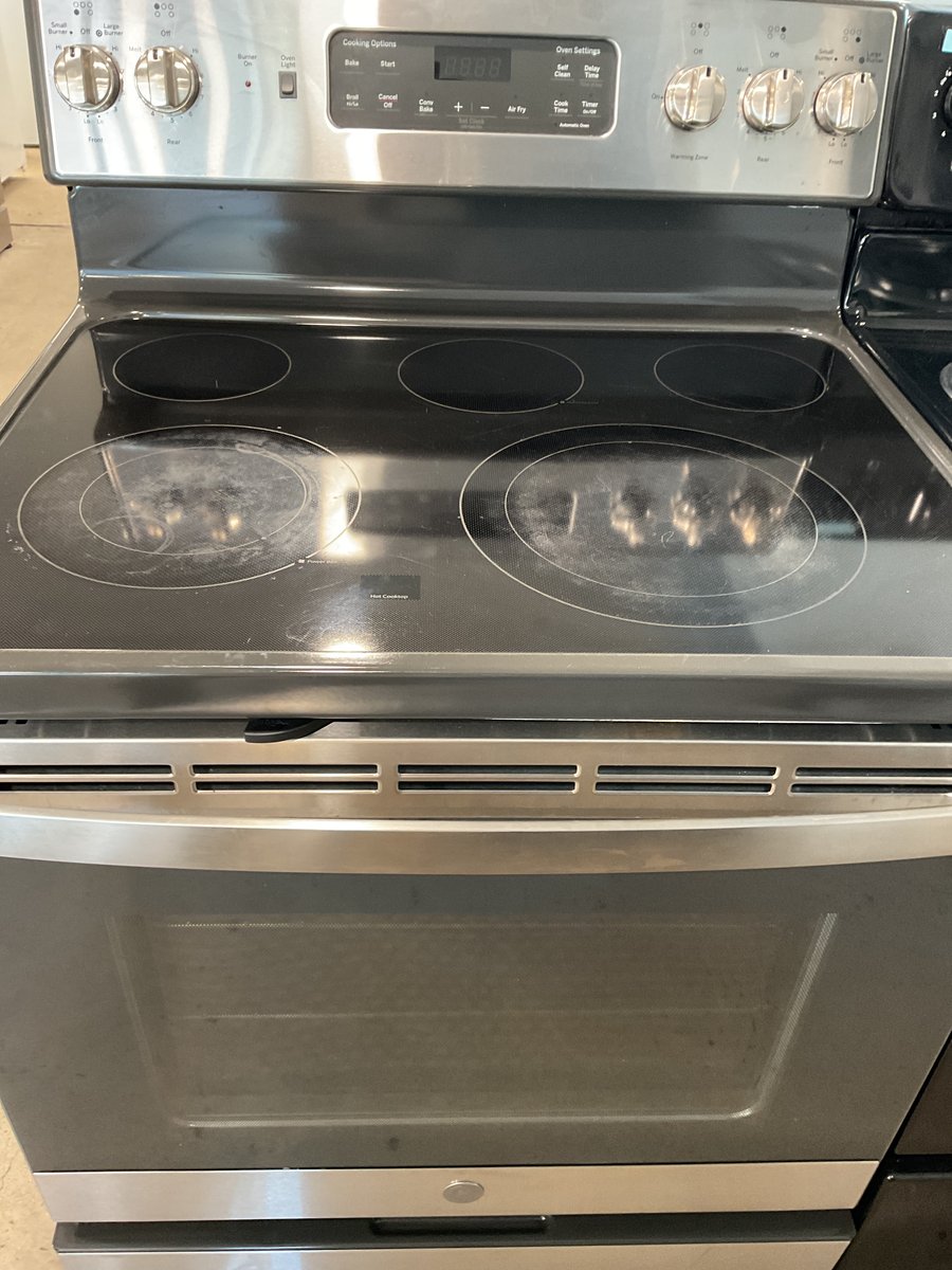 Photo 1 of this exact GE Glass top stainless steel convection range