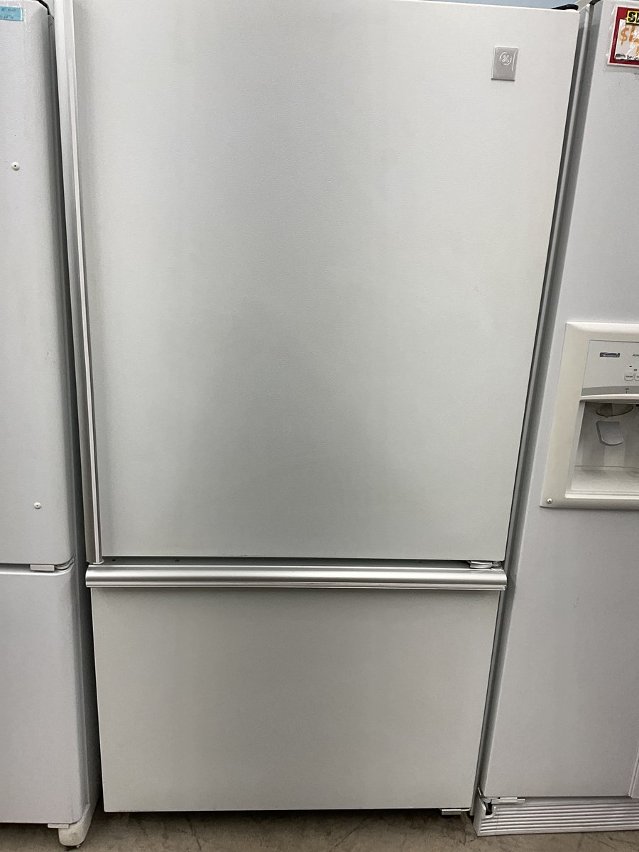 Photo 1 of this exact GE White bottom freezer refrigerator