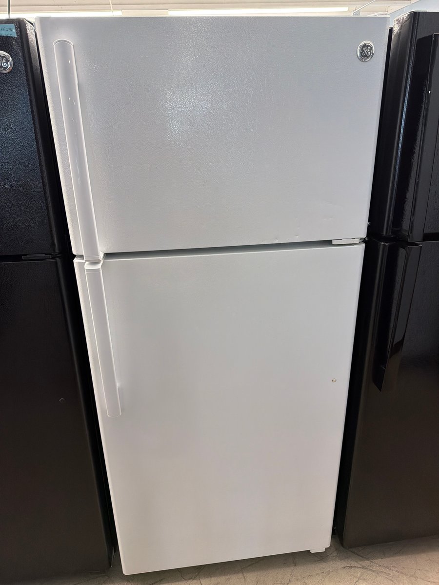 Photo 1 of this exact GE White top mount refrigerator