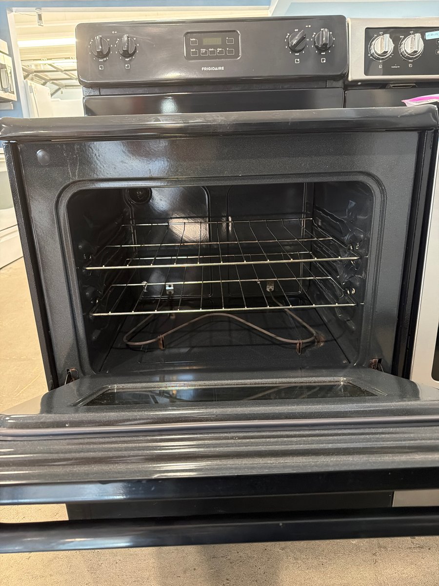Photo 2 of this exact Frigidaire Black coil top range
