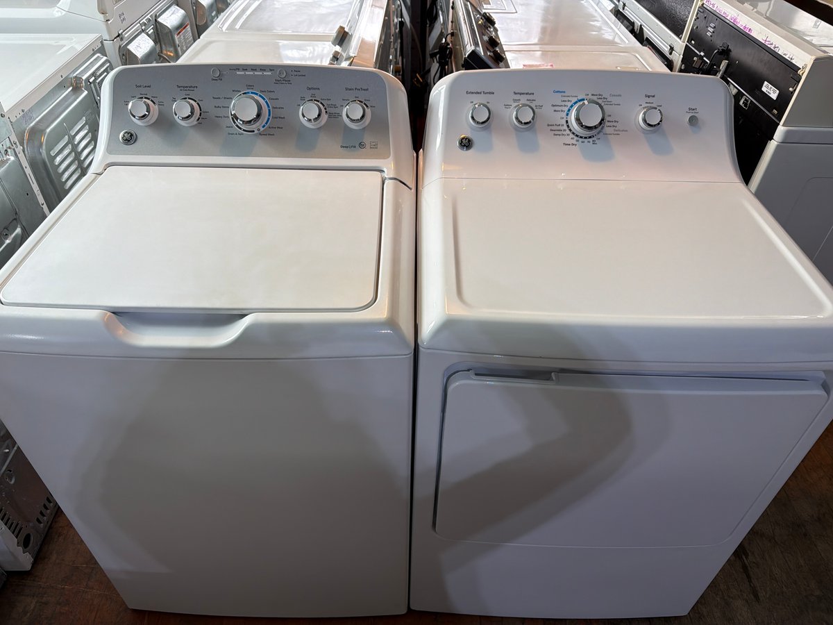 Photo 1 of this exact GE Top load washer and a dryer set