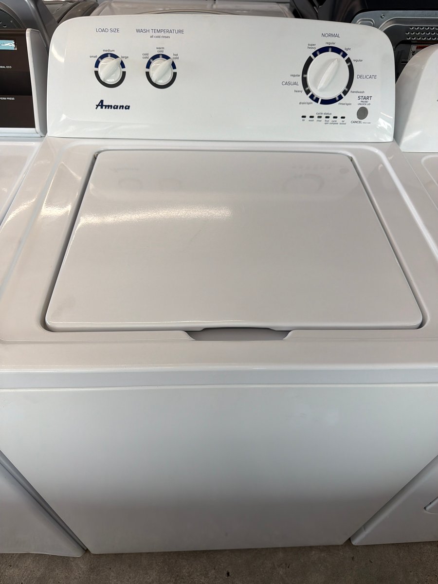 Photo 2 of this exact Amana Top load washer and dryer set