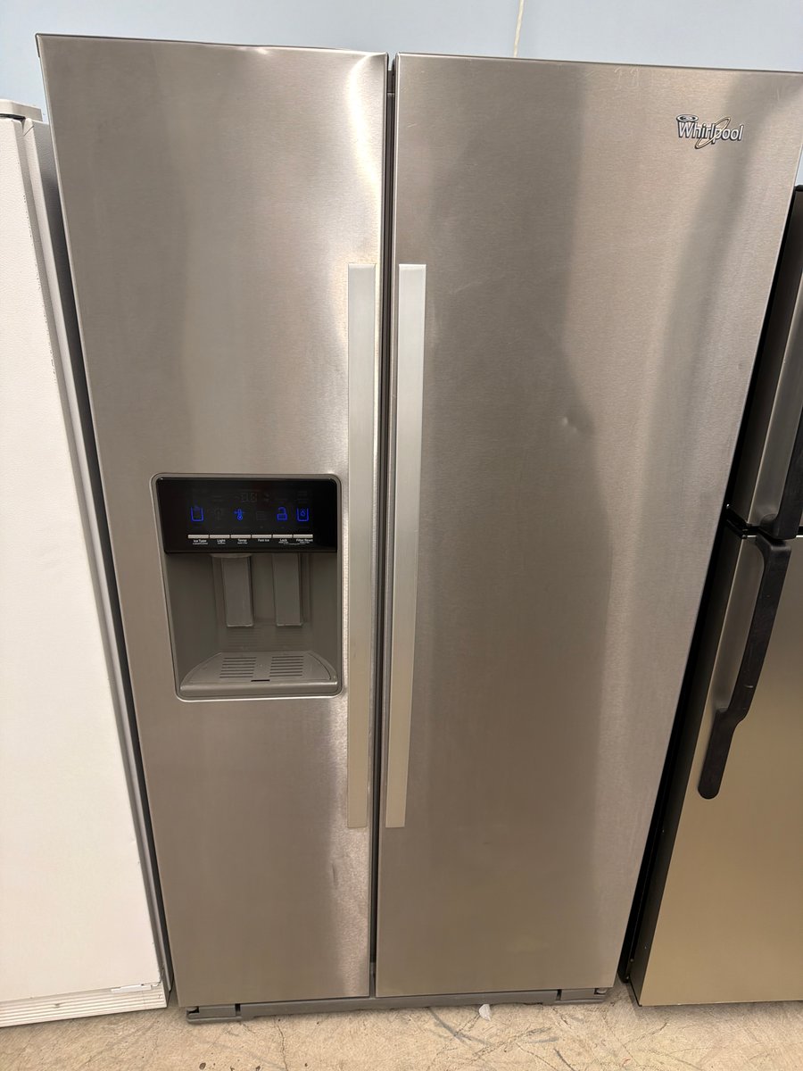 Photo 1 of this exact Whirlpool Stainless steel side by side refrigerator