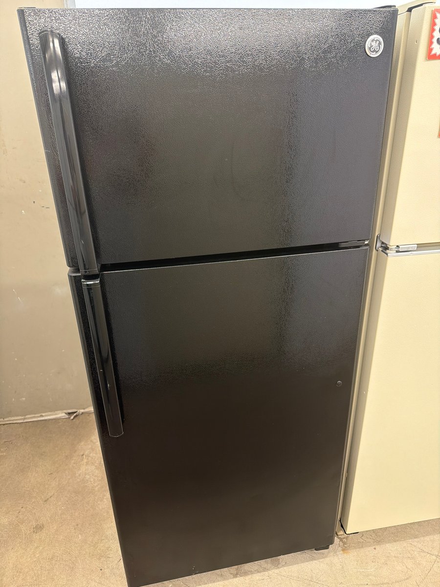 Photo 1 of this exact GE Black top mount refrigerator