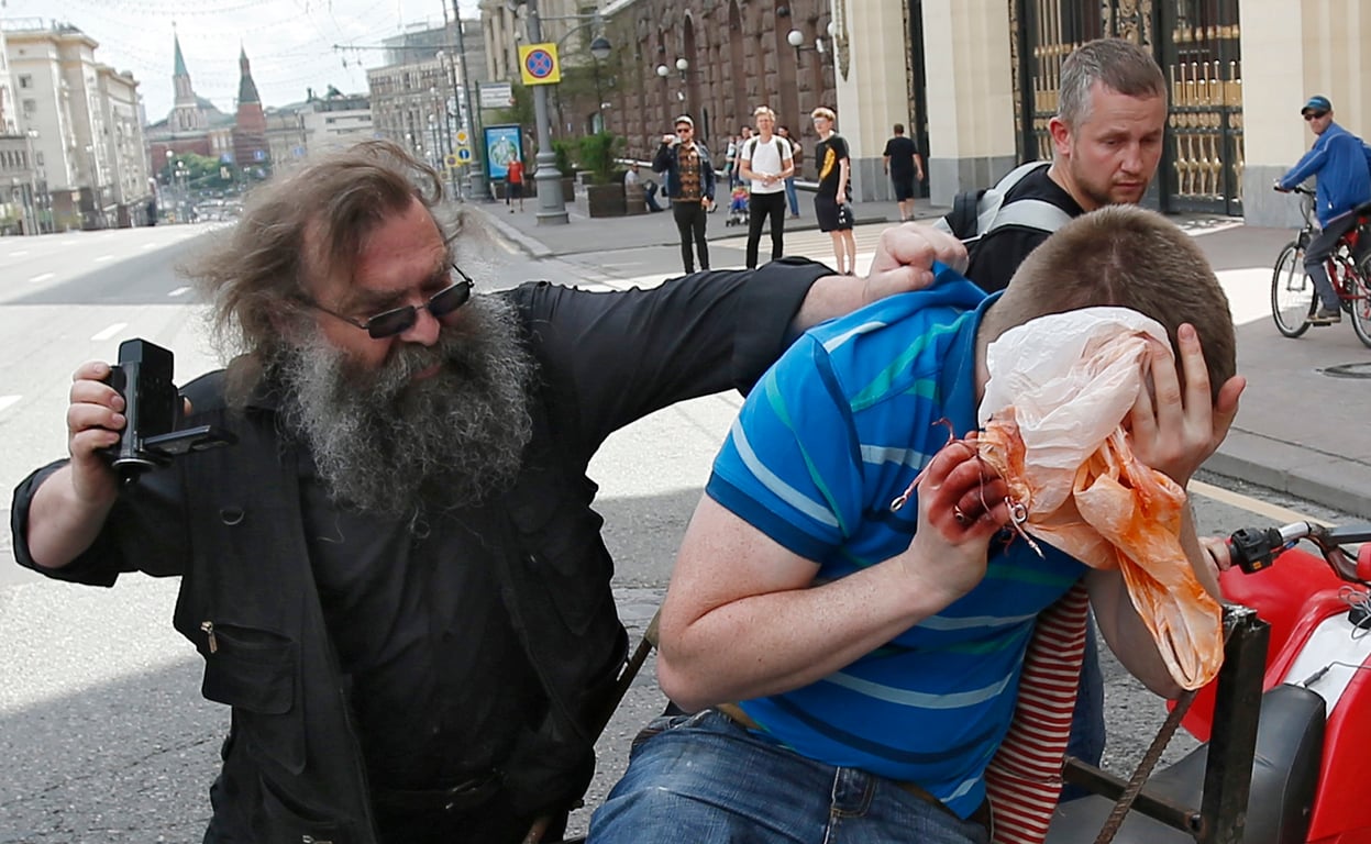 LGBT activist Nikolay Alekseyev is attacked by a homophobe while campaigning for the authorities to allow a Moscow Pride parade, 30 May 2015. Photo: EPA / Sergei Ilnitsky