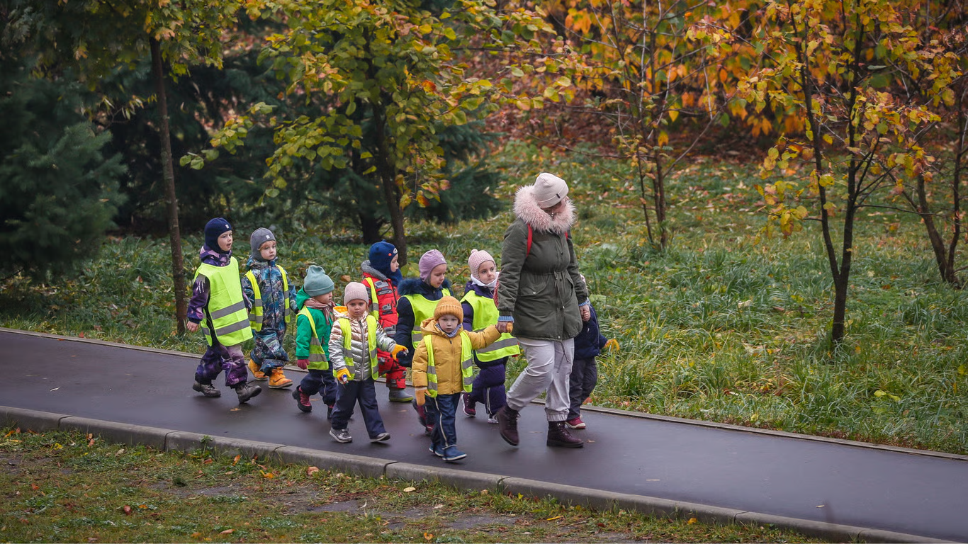 A group of children have a morning walk in a park in Moscow, Russia, 2 November 2020. EPA / YURY KOCHETKOV