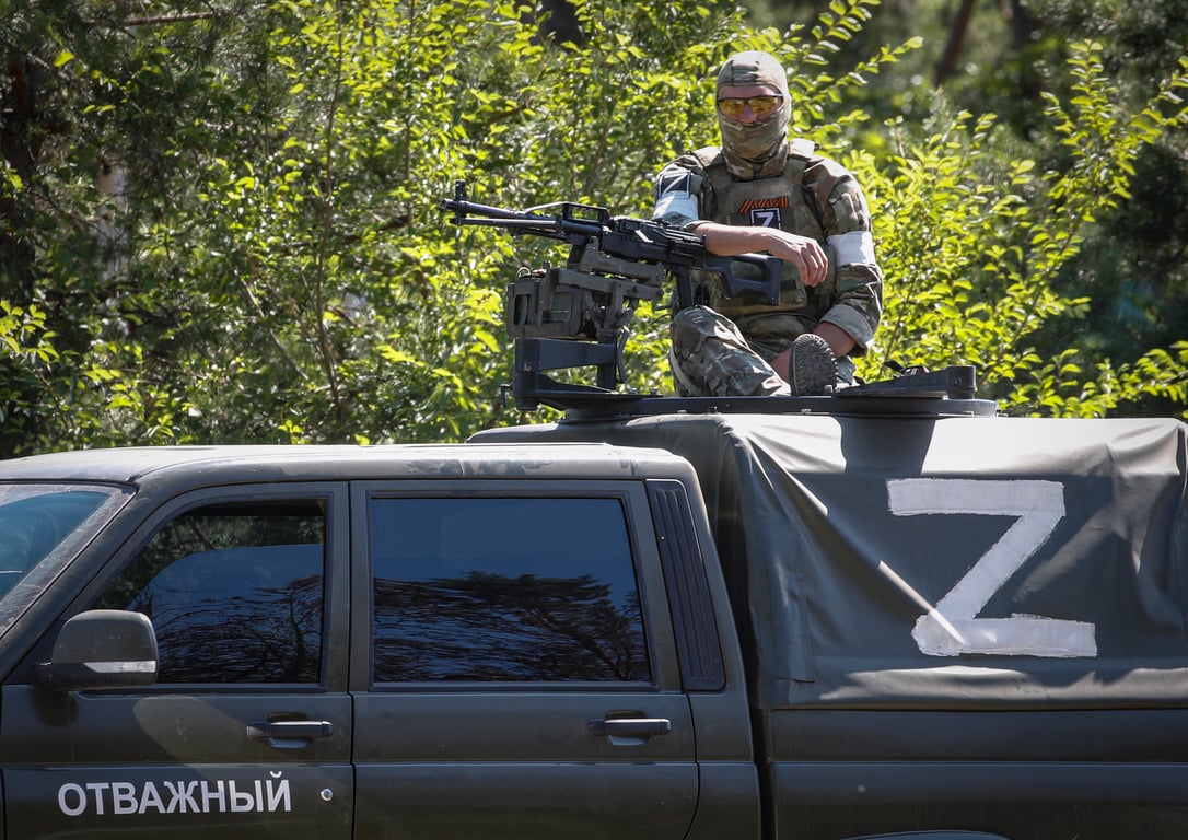 A Russian serviceman on patrol in the Luhansk region town of Schastia, eastern Ukraine, 11 June 2022. Photo: EPA / Sergei Ilnitsky