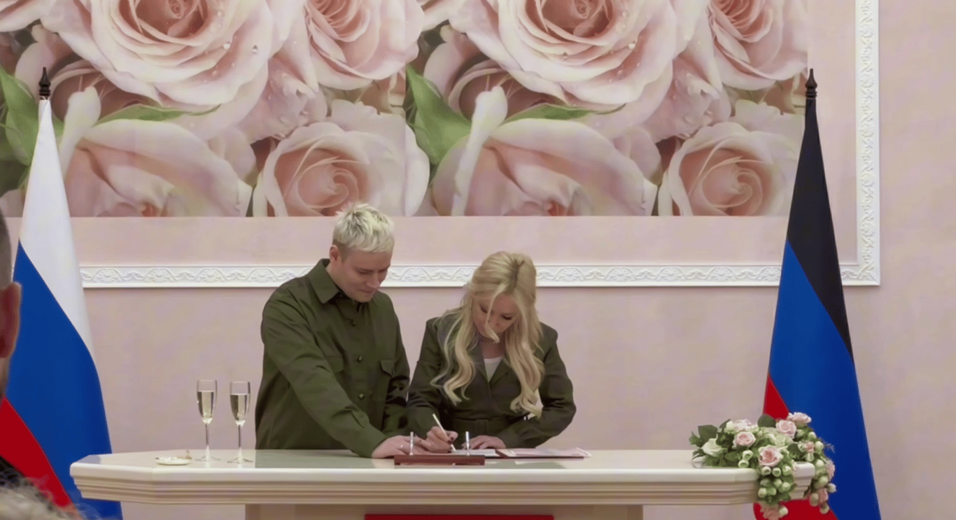 Shaman and Yekaterina Mizulina sign the marriage register in Donetsk, occupied eastern Ukraine. Photo: Telegram
