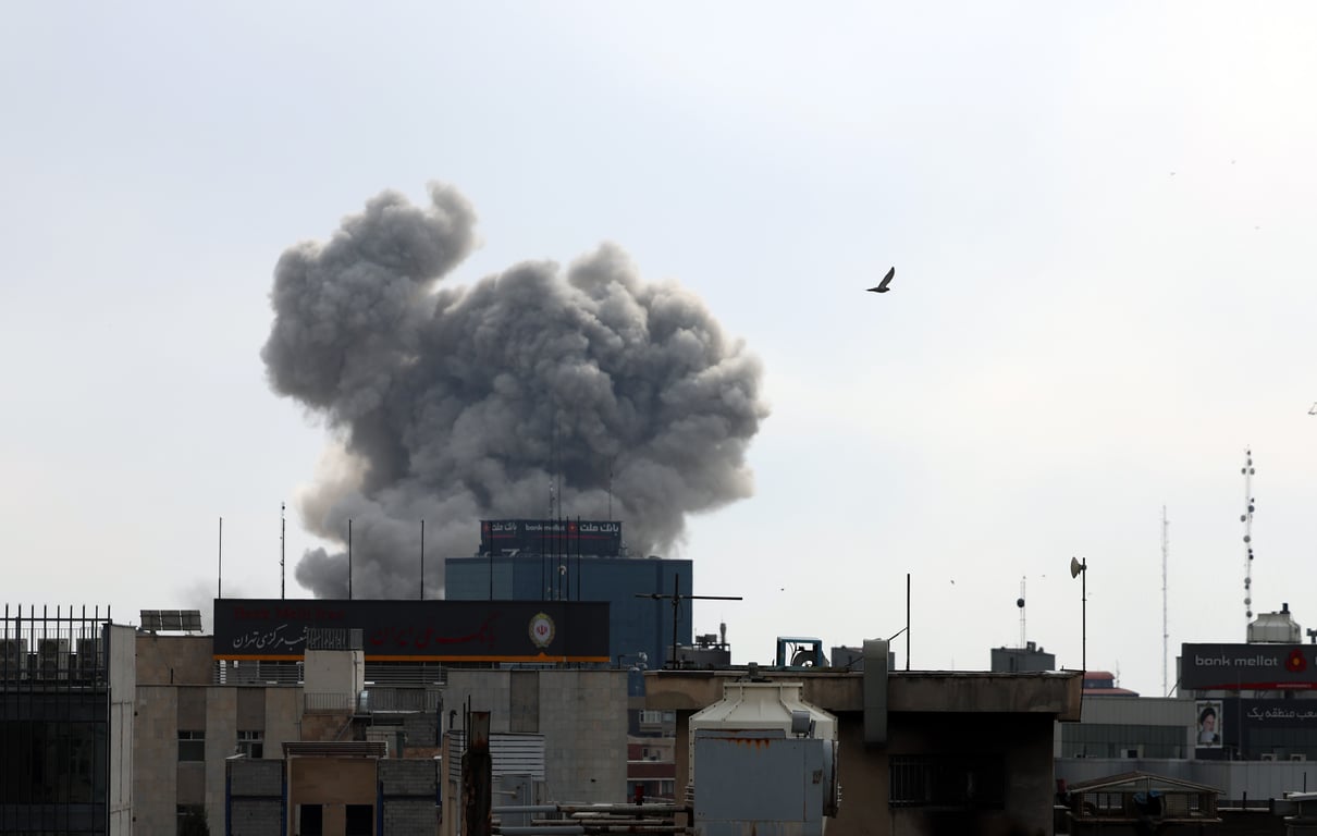 Smoke rises from a building in central Tehran following a US airstrike, 2 March 2026. Photo: EPA / Abedin Taherkenareh