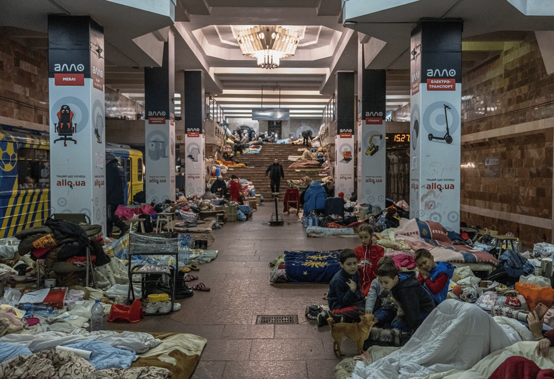 Civilians take shelter in a metro station during Russian airstrikes on Ukraine’s second city Kharkiv, 28 March 2022. Photo: EPA / Roman Pipley