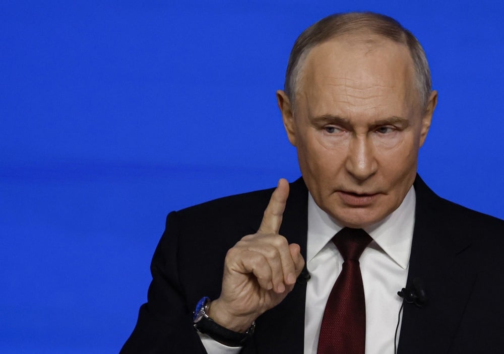 Putin gestures as he answers questions during his annual Direct Line call-in show at Moscow’s Gostiny Dvor, 19 December 2025. Photo: EPA / SERGEI ILNITSKY