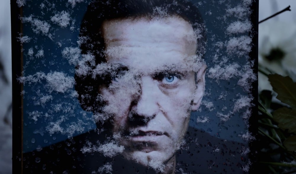 Snowflakes partially cover the portrait of late Russian opposition leader Alexey Navalny, marking the first anniversary of his death, outside the Russian Embassy in Bucharest, Romania, 16 February 2025. Photo: EPA/ROBERT GHEMENT