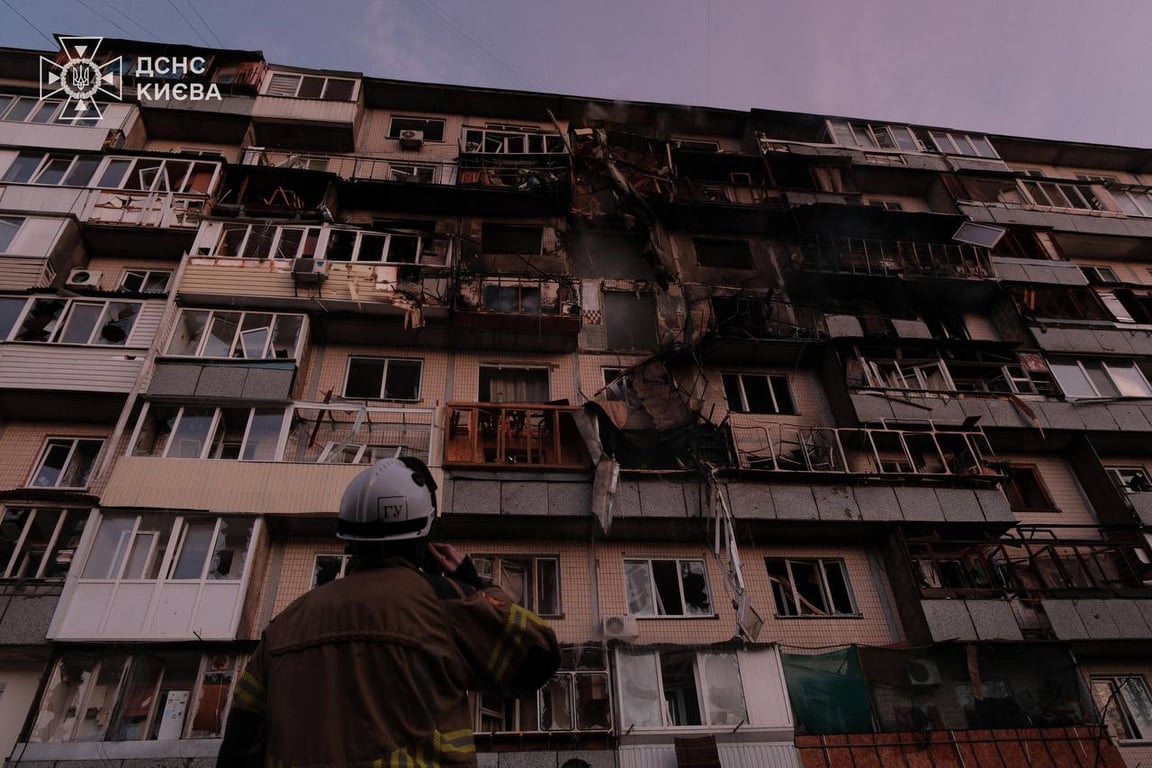 A Ukrainian rescue workers surveys the damage to an apartment block in Kyiv, 14 November 2025. Photo: Zelensky / Telegram