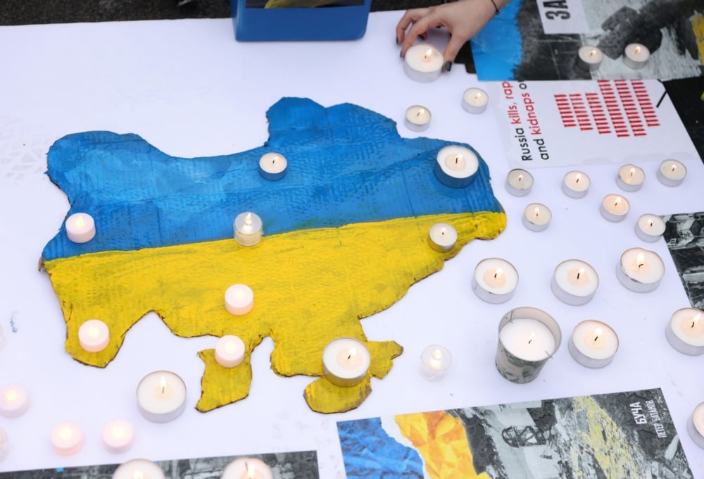 Candles are lit over the drawing of a map of Ukraine during a rally marking the second anniversary of the Russian invasion of Ukraine, in Belgrade, Serbia, 24 February 2024. Photo: EPA/ANDREJ CUKIC