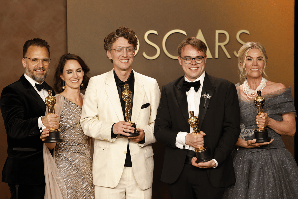 David Borenstein (C-L) and Pavel Talankin (C-R) pose with the Oscar for Best Documentary Feature at the Dolby Theatre in Los Angeles, 15 March 2026. Photo: EPA / Jill Connelly