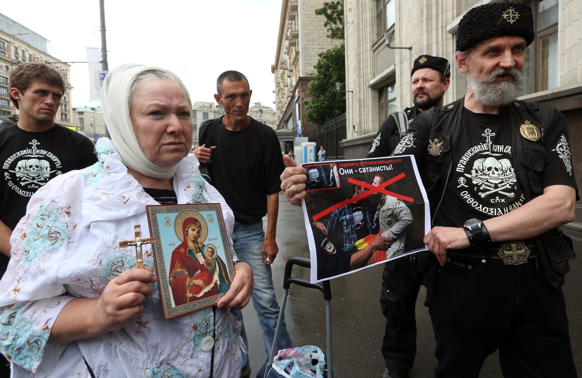 Anti-gay protestors picket an LGBT rights rally outside Russia’s State Duma in Moscow, 11 June 2013. Photo: EPA / Sergei Chirikov