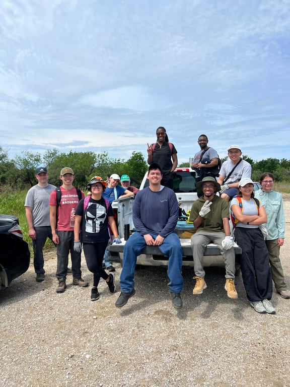 DFWYAS volunteers sitting on the back of a truck at an event.