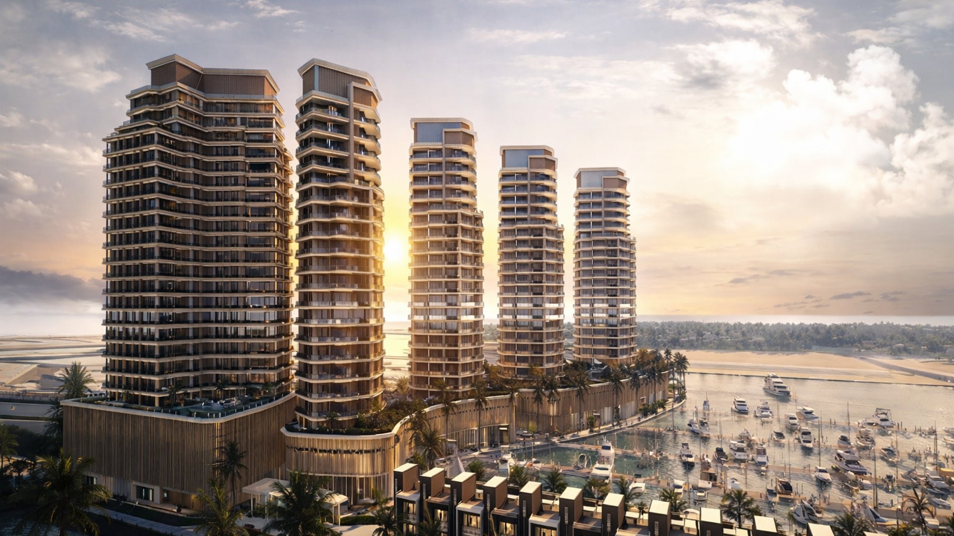 Al Hamra Wohnhochhäuser am Wasser und Marina-Wohnquartier in Ras Al Khaimah mit Wohnen im Stil einer Ferienanlage und Küstensilhouette bei Sonnenuntergang