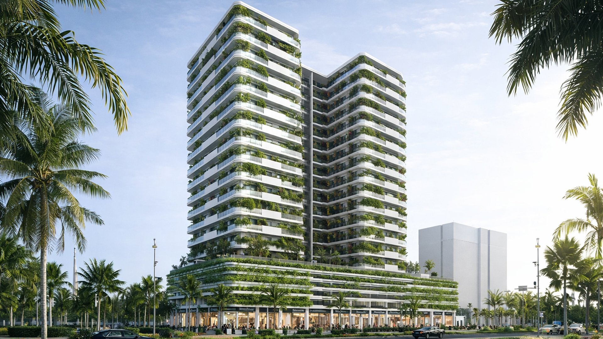 Al Helal Al Zahaby Real Estate mit modernen Wohntürmen, begrünten Terrassen, Einzelhandelspodium und urbaner Boulevard-Kulisse in Dubai