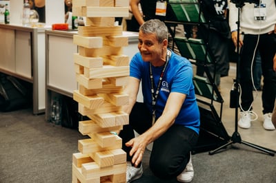 Attendees playing giant Jenga between sessions.