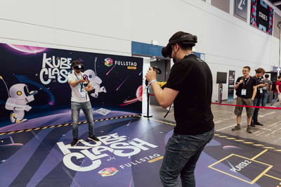 Attendee in a VR headset at the gaming corner.