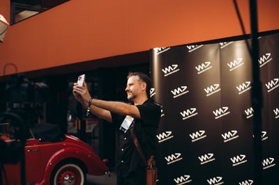 Attendees taking a selfie at the event.