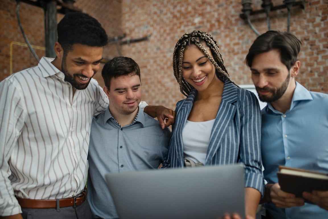 A diverse group of young people in the office
