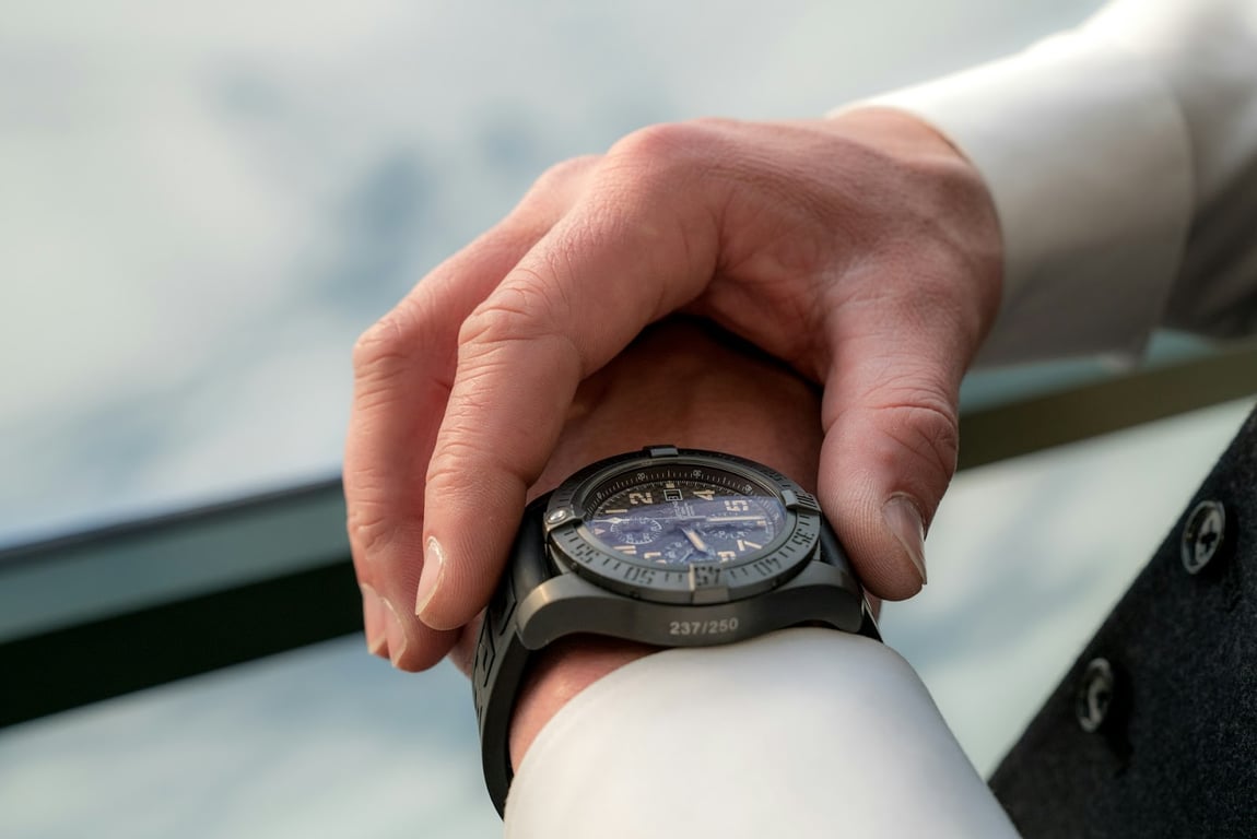 A close up of a man timing using his wristwatch