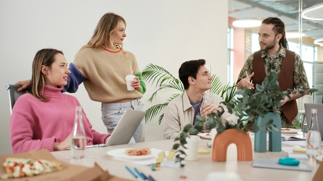 A young team of office workers having a chat over lunch