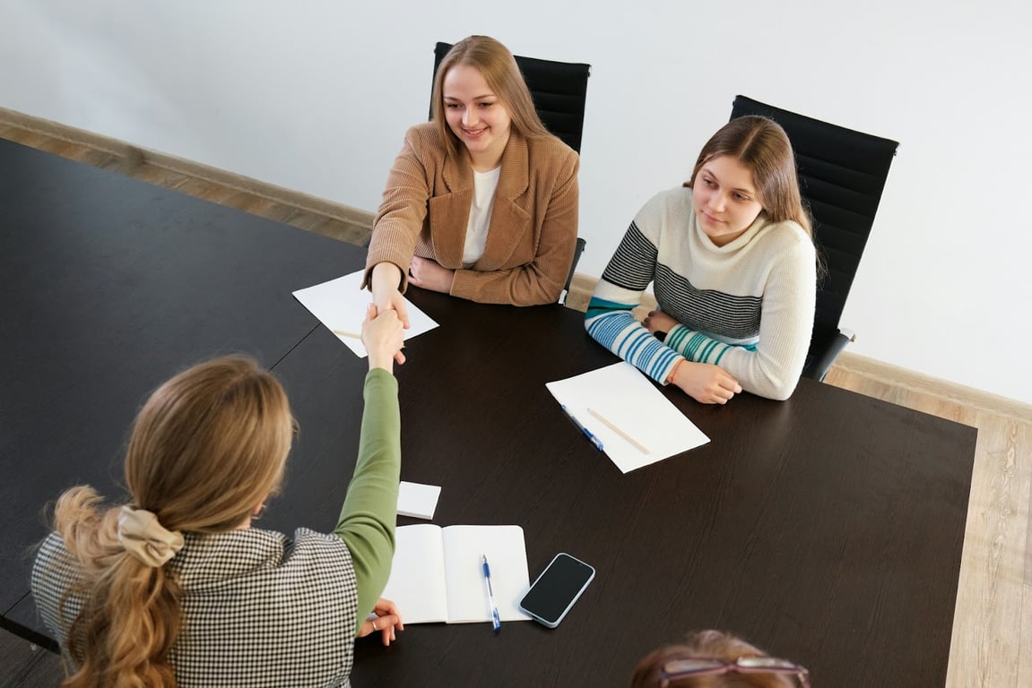 A female HR team welcomes a new employee
