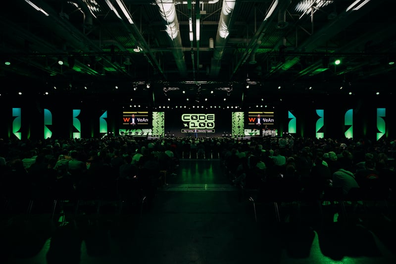 CODE100 competitors on the Main Stage during a previous edition.