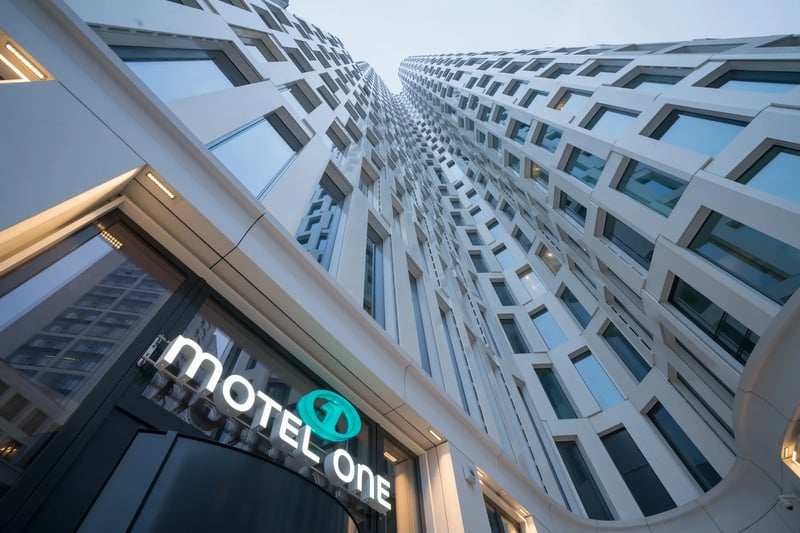 Motel One Berlin-Upper West exterior at dusk.