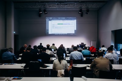 Attendees collaborating during a hands-on workshop session.