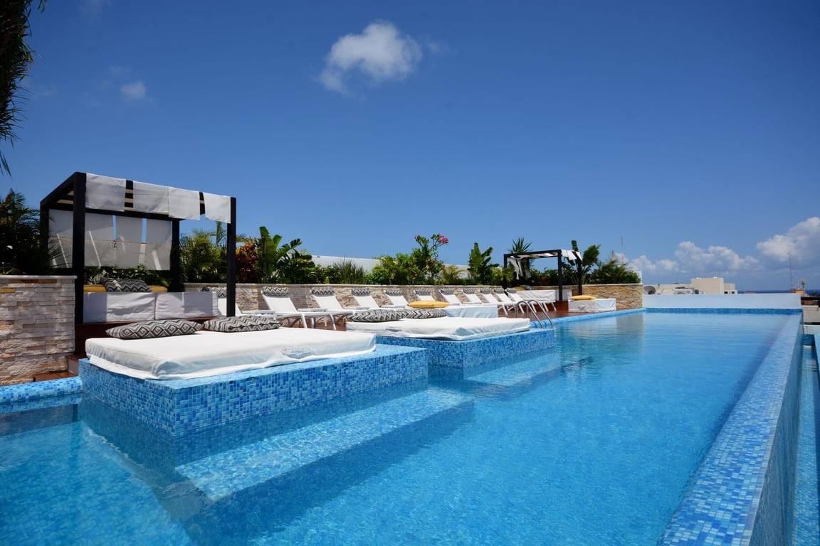 The City N103: Corner Oasis with Rooftop Views in Playa del Carmen