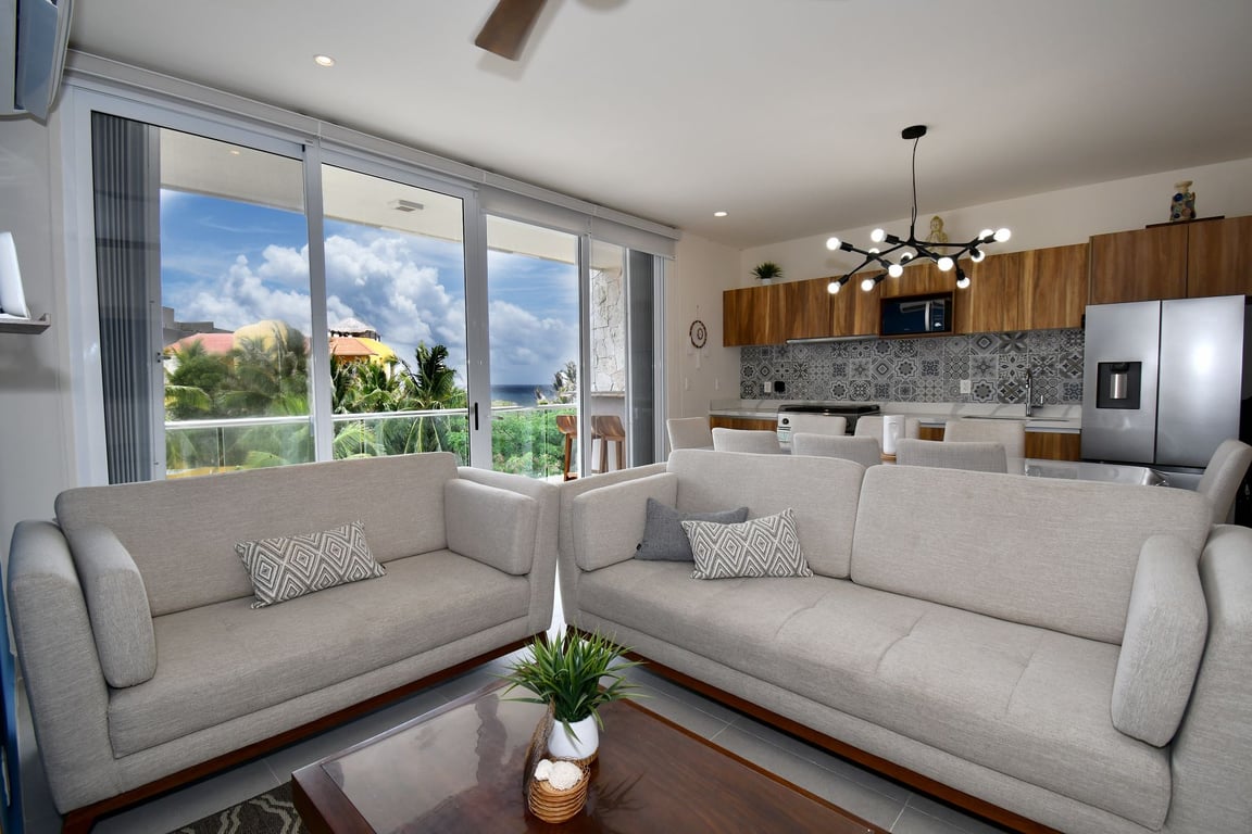 Caribbean Penthouse Living: Rooftop Paradise with Private Beach Club in Akumal