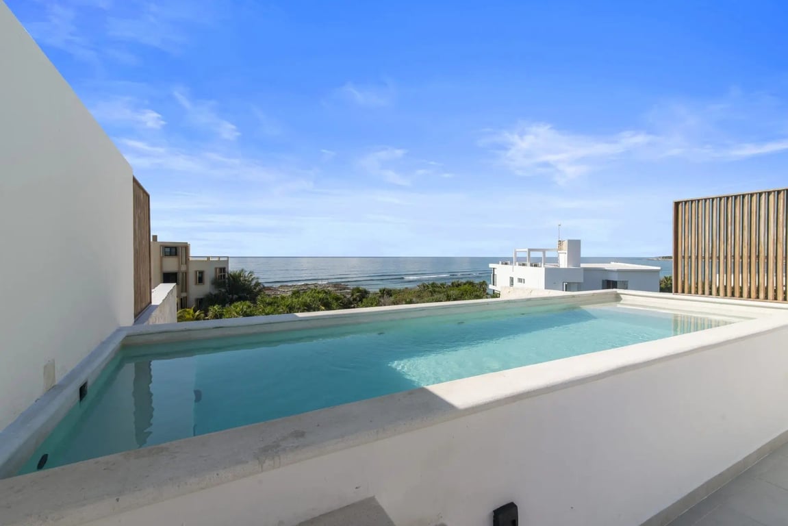 Dual-Terrace Akumal Penthouse with Rooftop Jacuzzi and Caribbean Sea Views