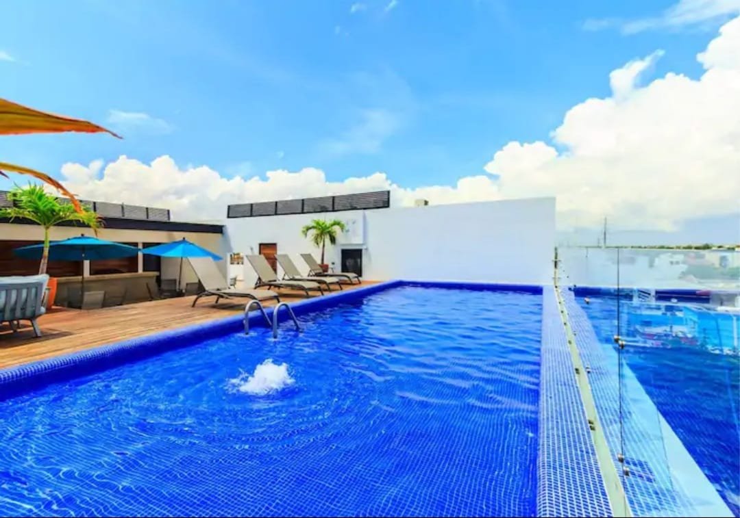 Luxury Living: Penthouse Paradise with Private Rooftop at Icono Playa