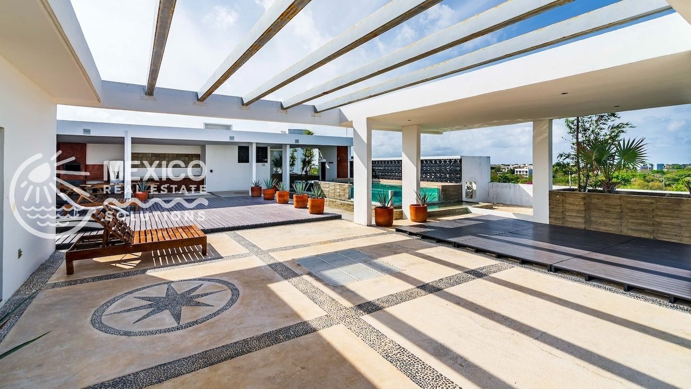 Sunlit 2-Bedroom Condo with Rooftop Oasis in Playa del Carmen